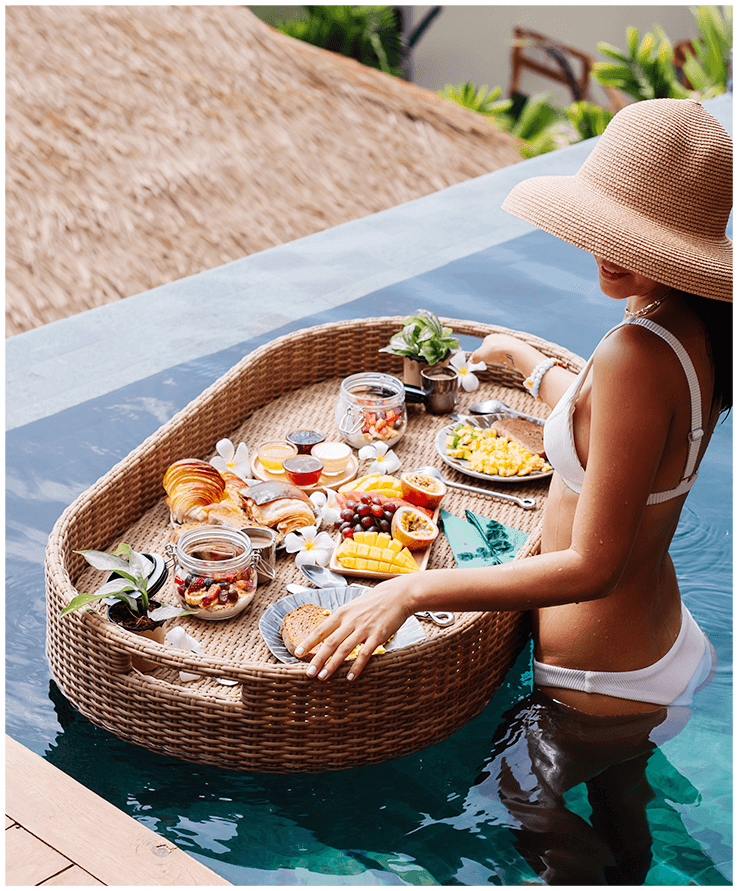 woman-having-tropical-healthy-breakfast-villa-floating-table
